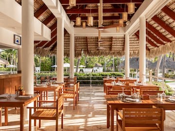 a restaurant with tables and chairs