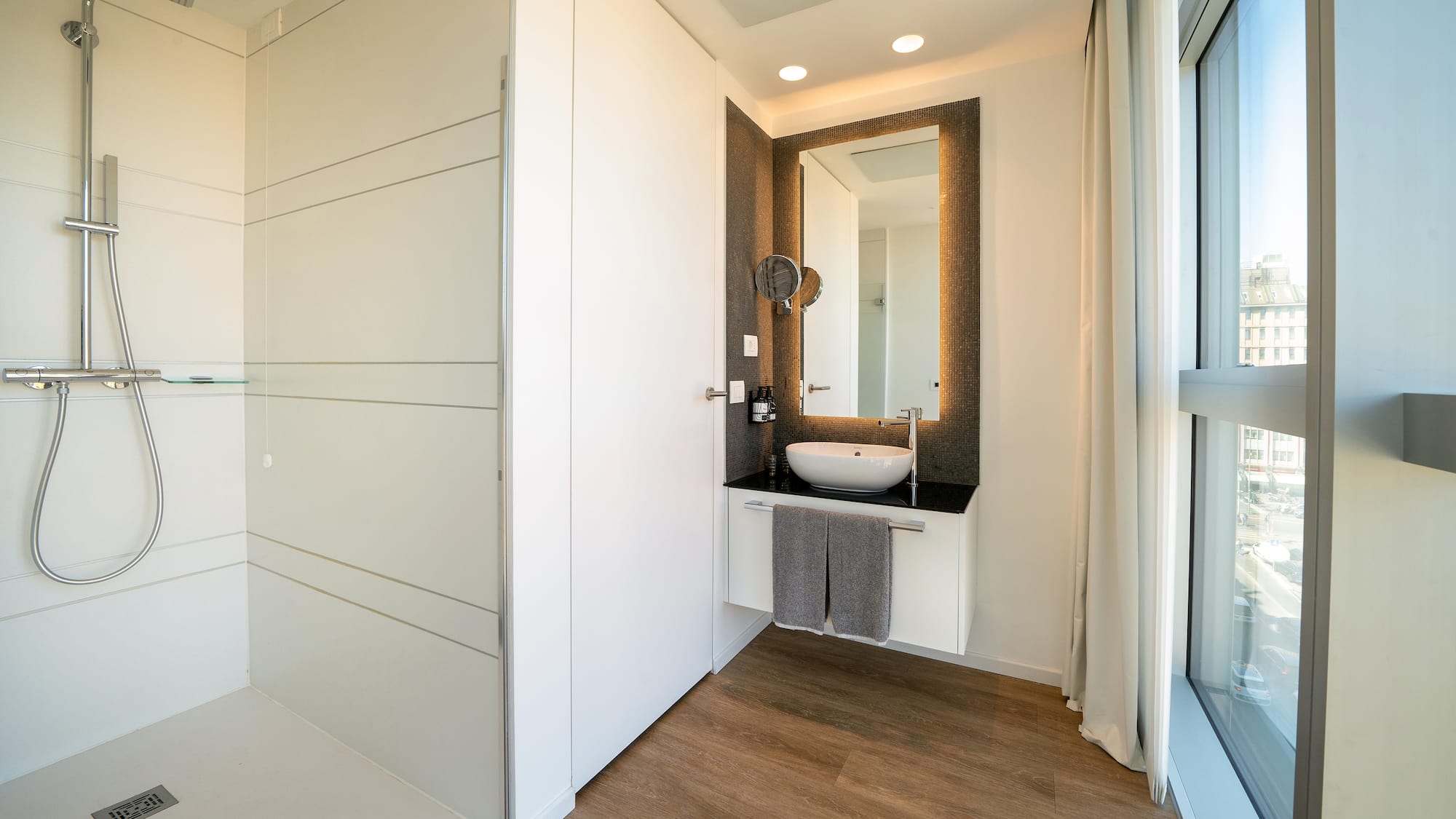 a bathroom with a mirror and a sink