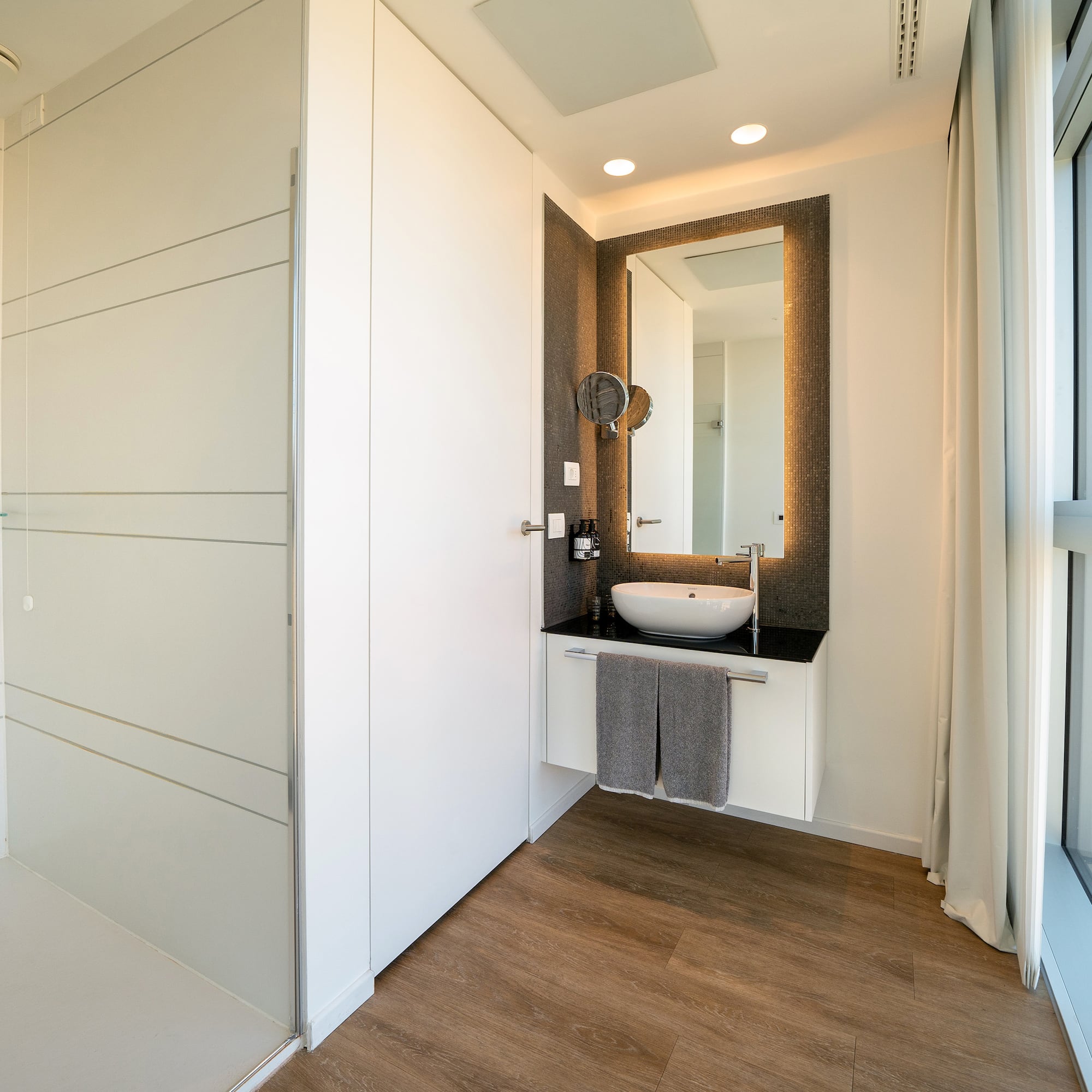 a bathroom with a mirror and a sink