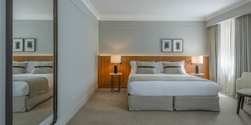 a bedroom with a large mirror