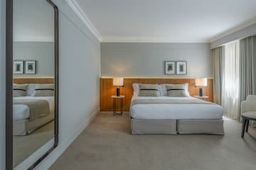 a bedroom with a large mirror