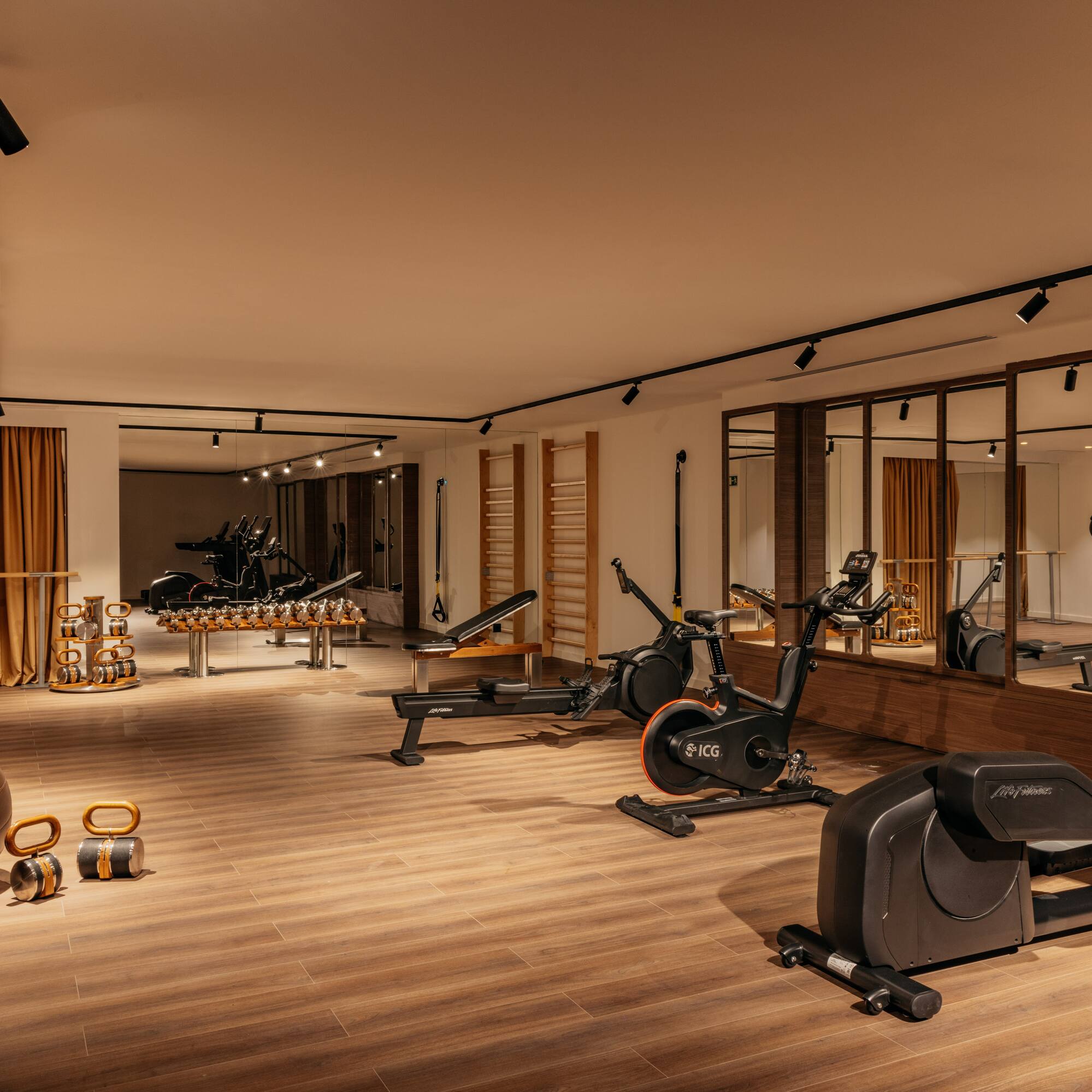 a room with exercise bikes and exercise balls