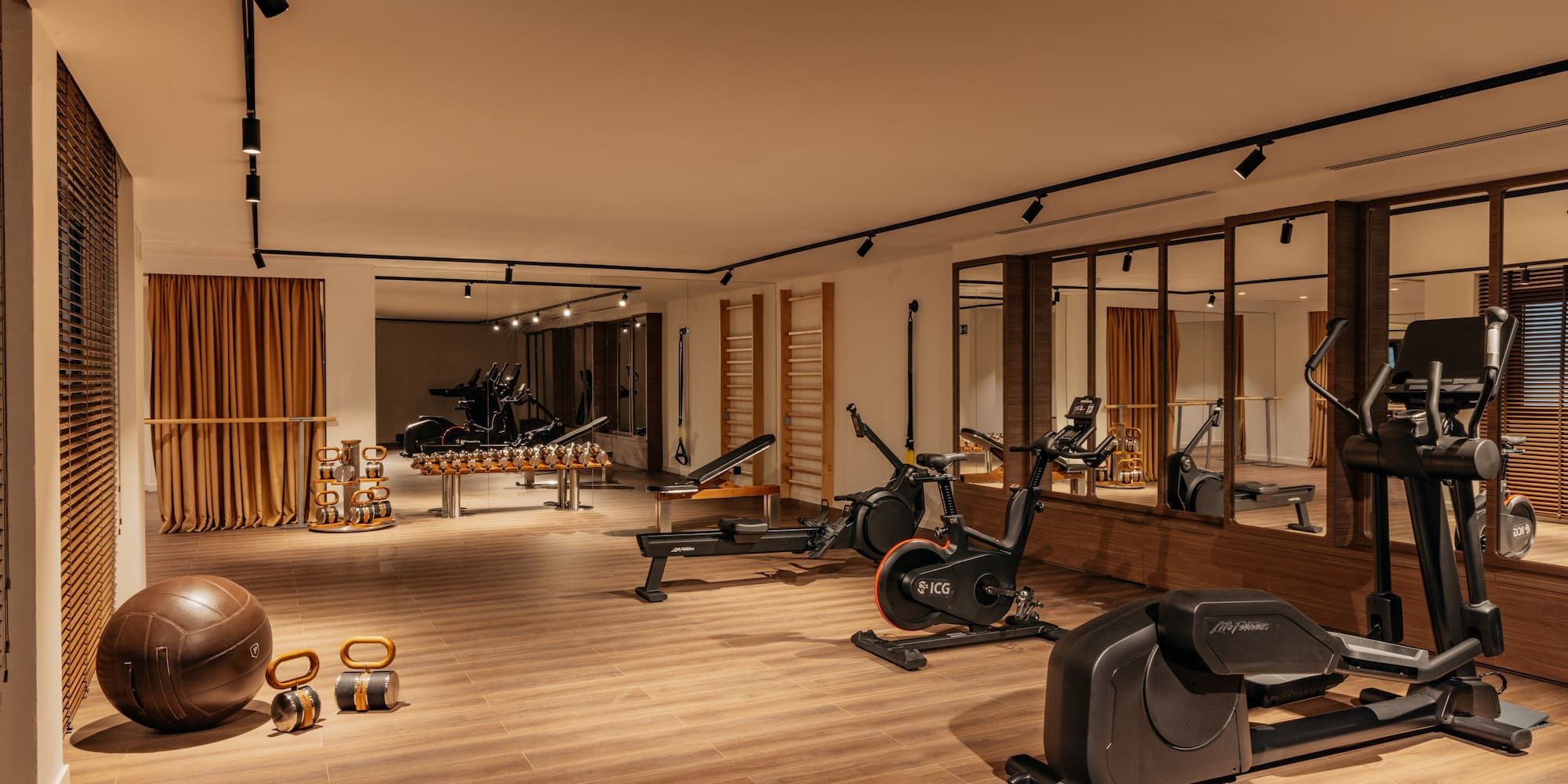 a room with exercise bikes and exercise balls