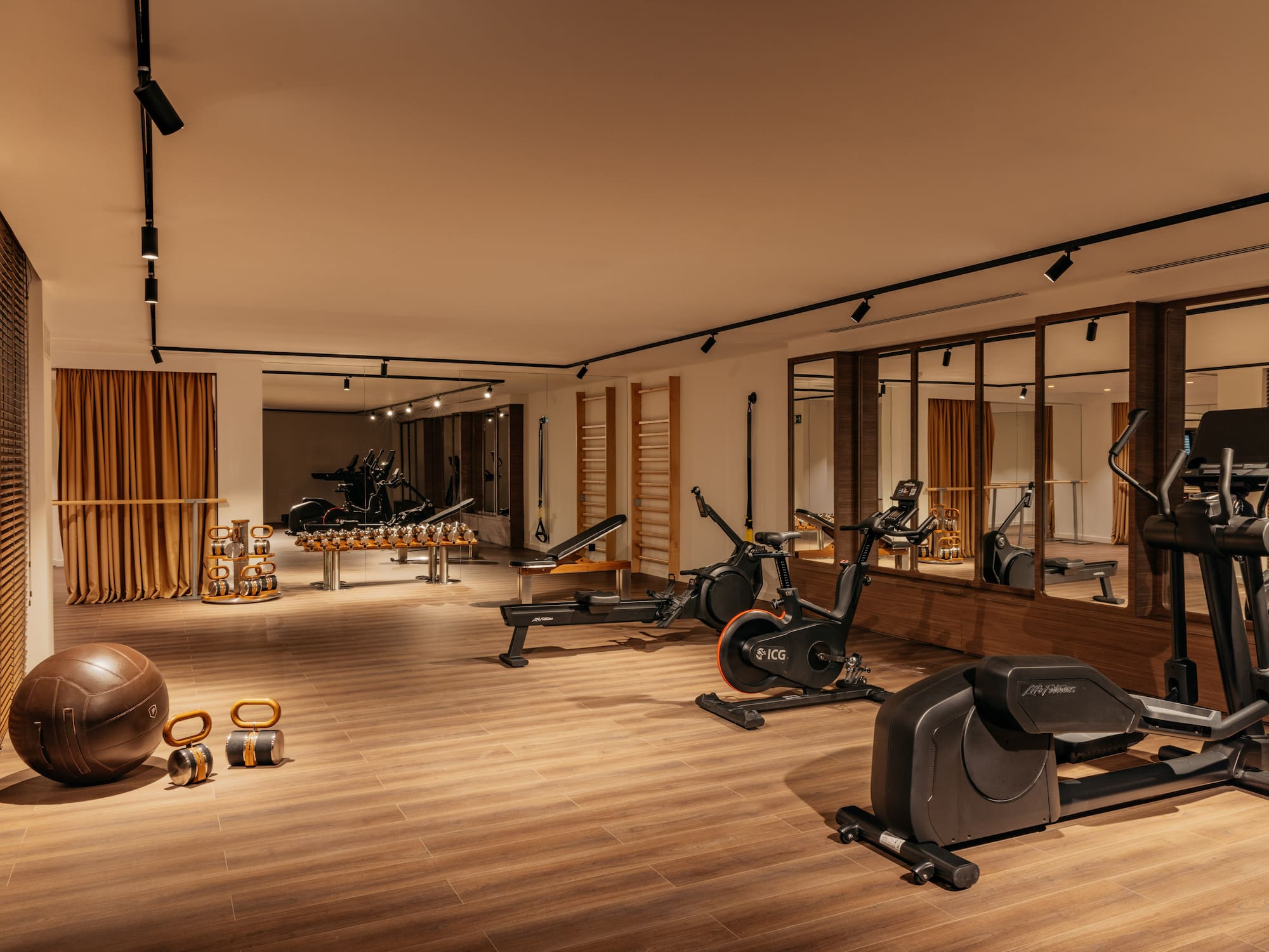 a room with exercise bikes and exercise balls