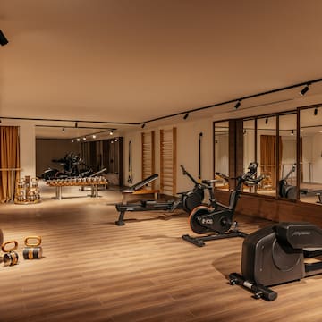 a room with exercise bikes and exercise balls