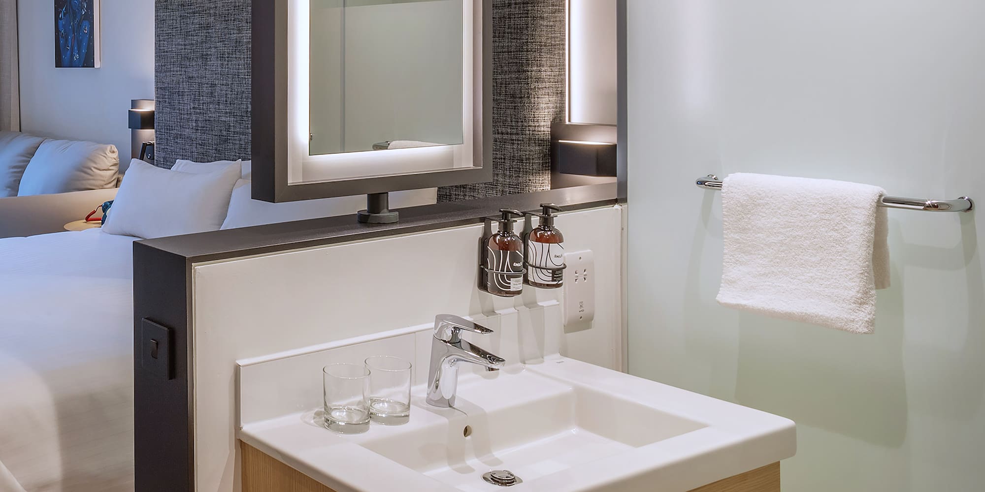 a bathroom with a mirror and sink