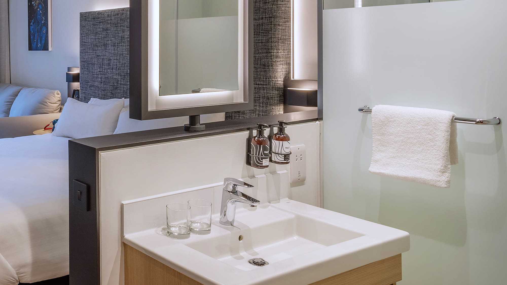 a bathroom with a mirror and sink