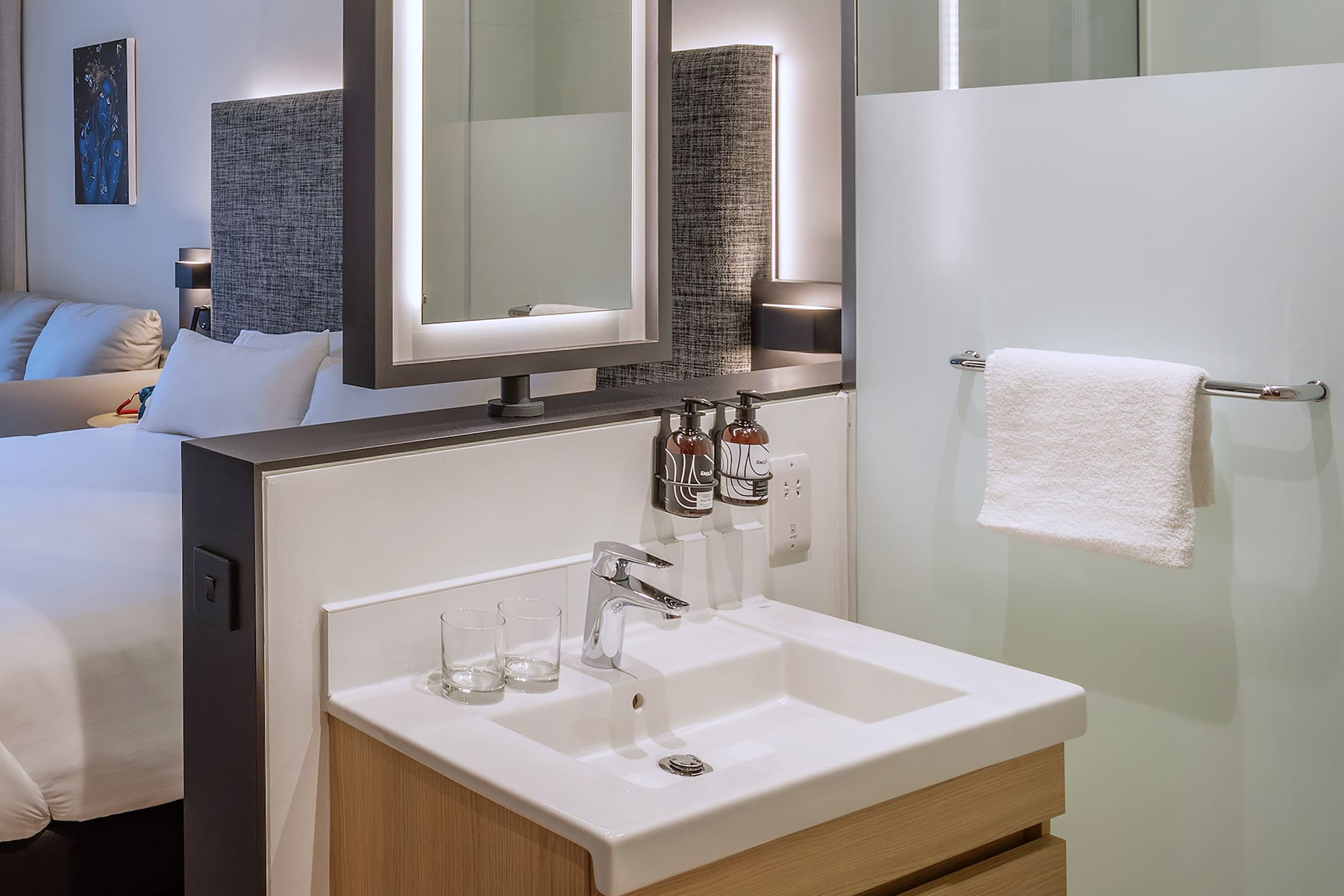 a bathroom with a mirror and sink