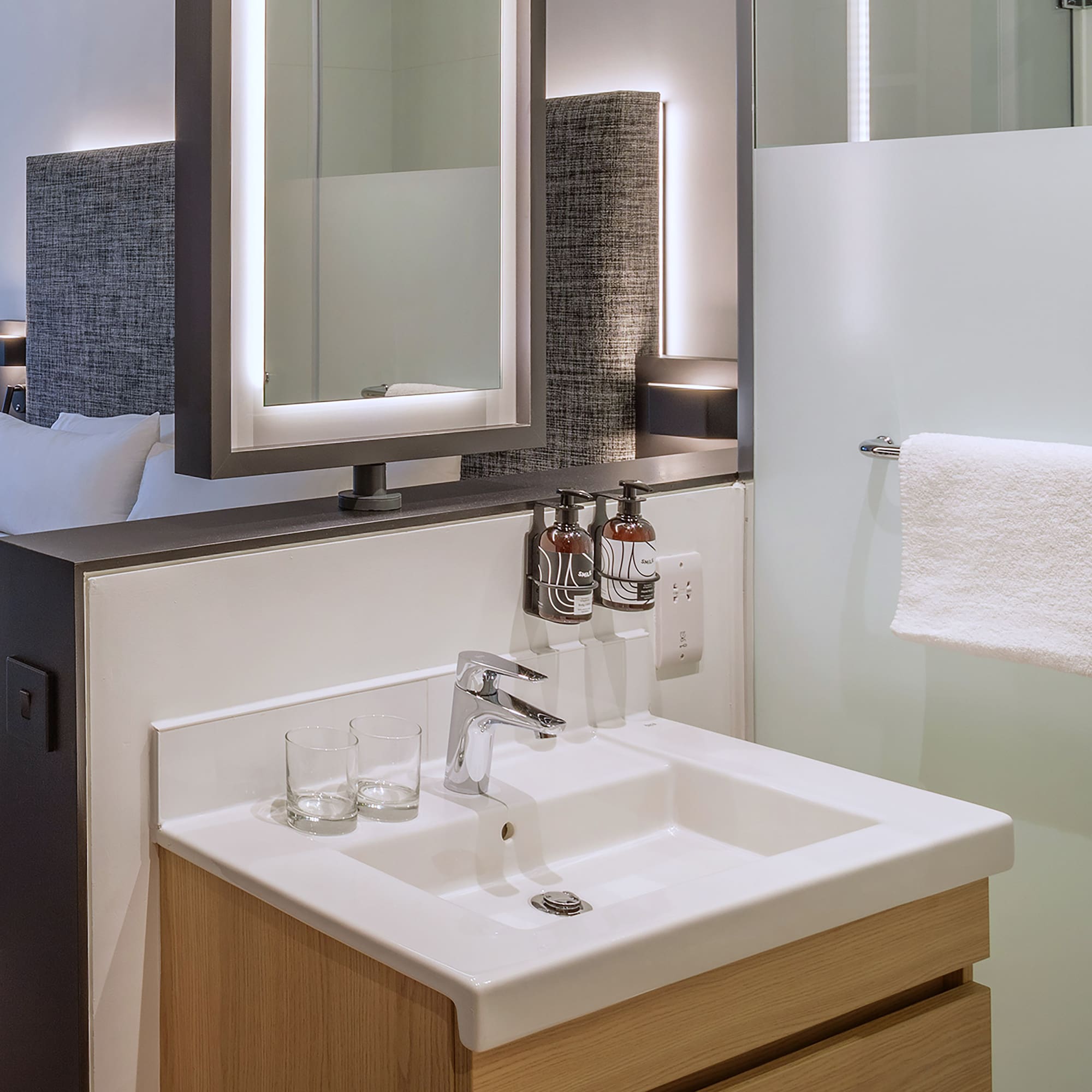 a bathroom with a mirror and sink