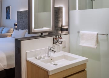 a bathroom with a mirror and sink