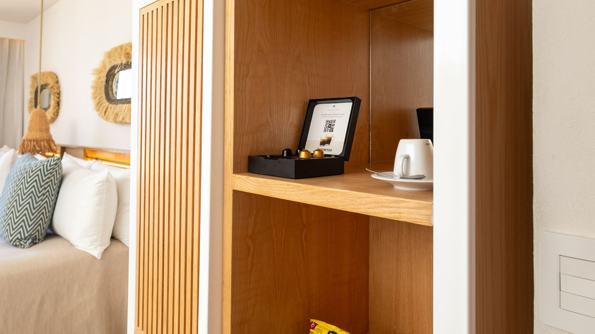 a shelf with snacks and a cup on it