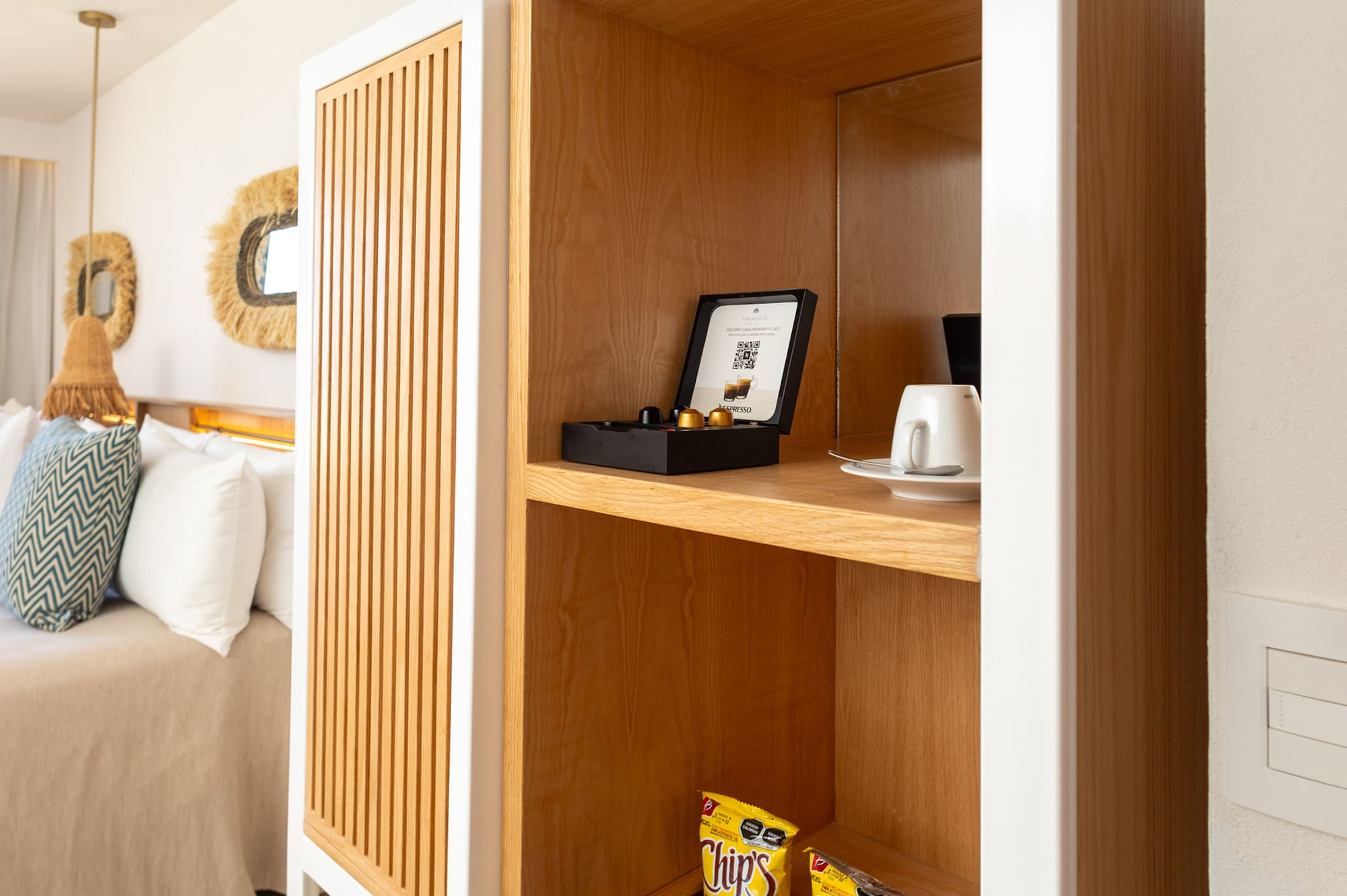 a shelf with snacks and a cup on it