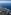 Aerial view of Mediterranean coastline, green land, coastal towns, and blue sea.