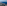 Aerial view of Mediterranean coastline, green land, coastal towns, and blue sea.
