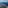 Aerial view of Mediterranean coastline, green land, coastal towns, and blue sea.
