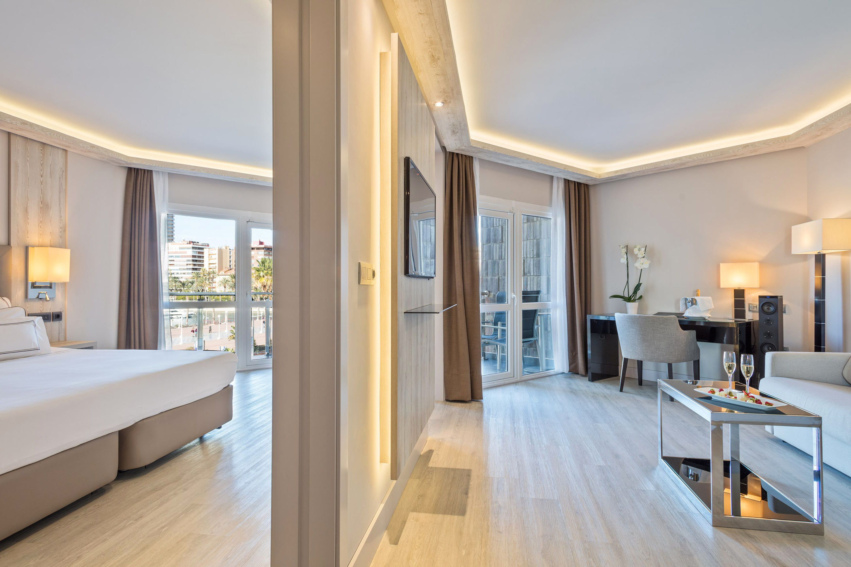 a room with a bed and a desk