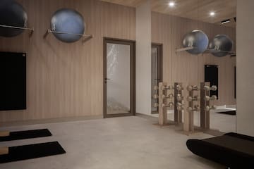 a room with exercise equipment and a door