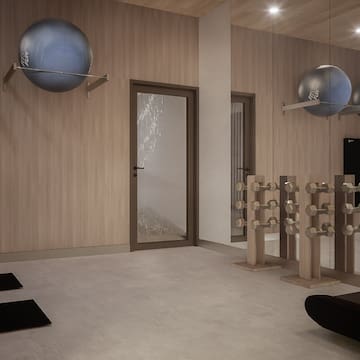 a room with exercise equipment and a door
