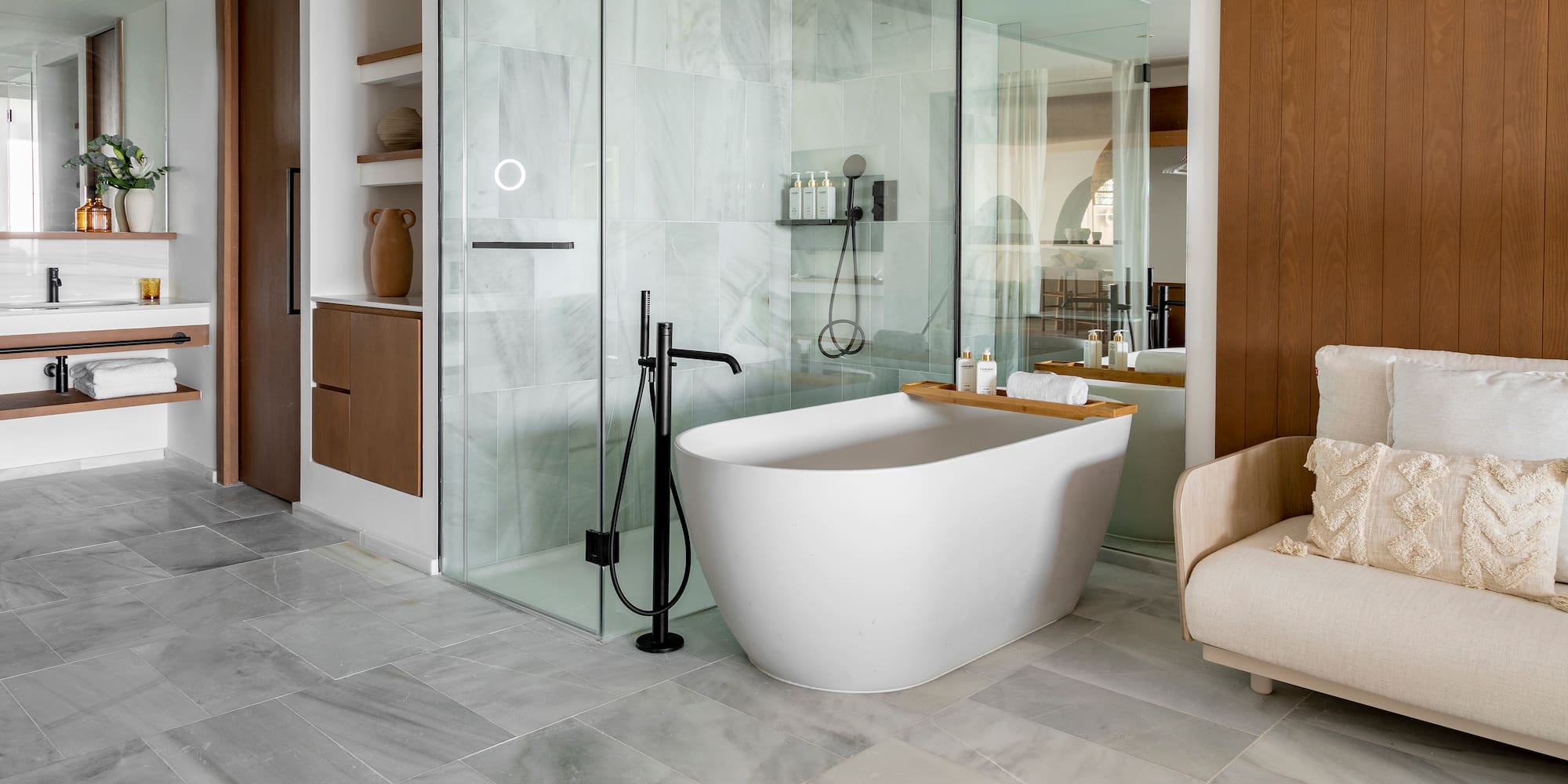 a bathroom with a tub and shower
