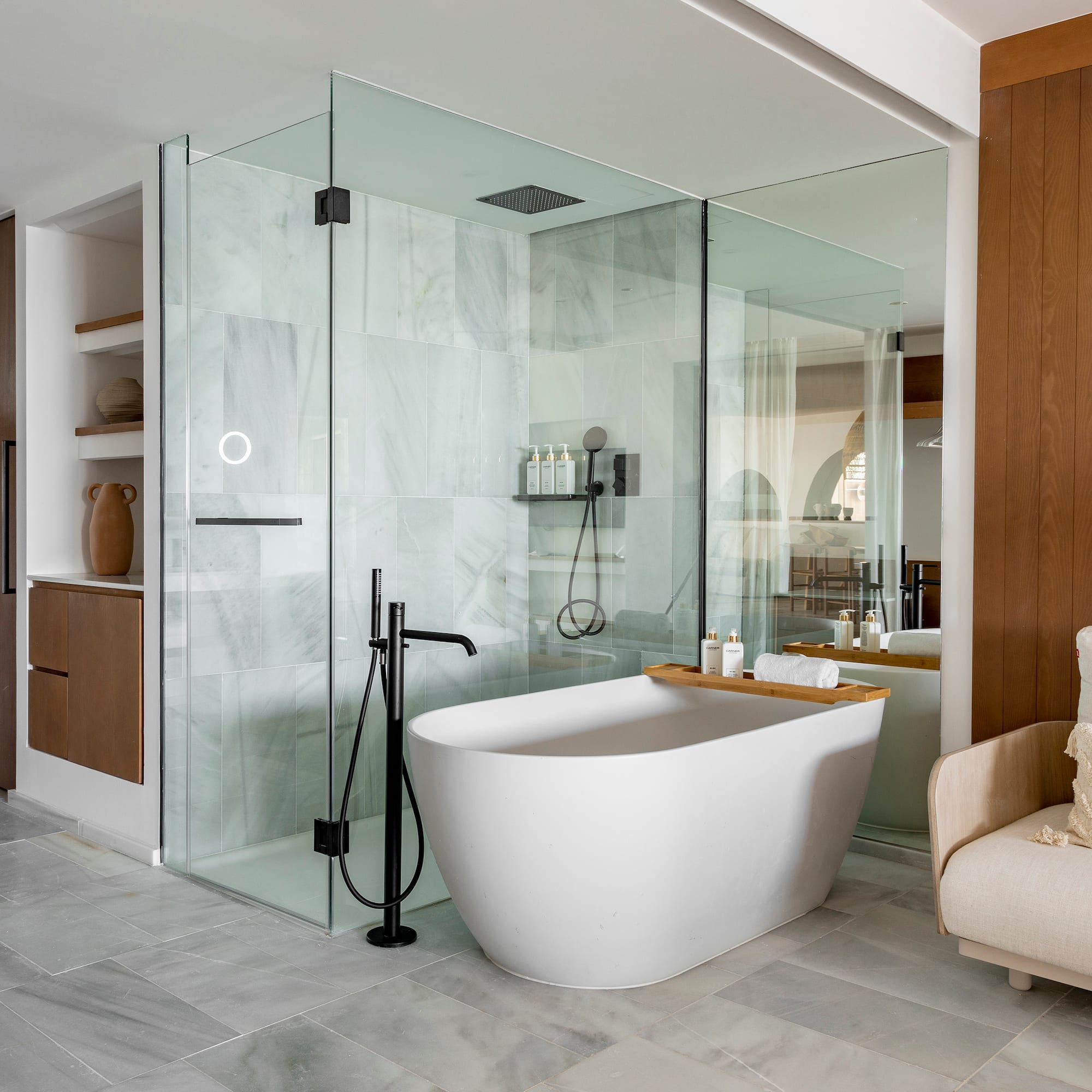 a bathroom with a tub and shower