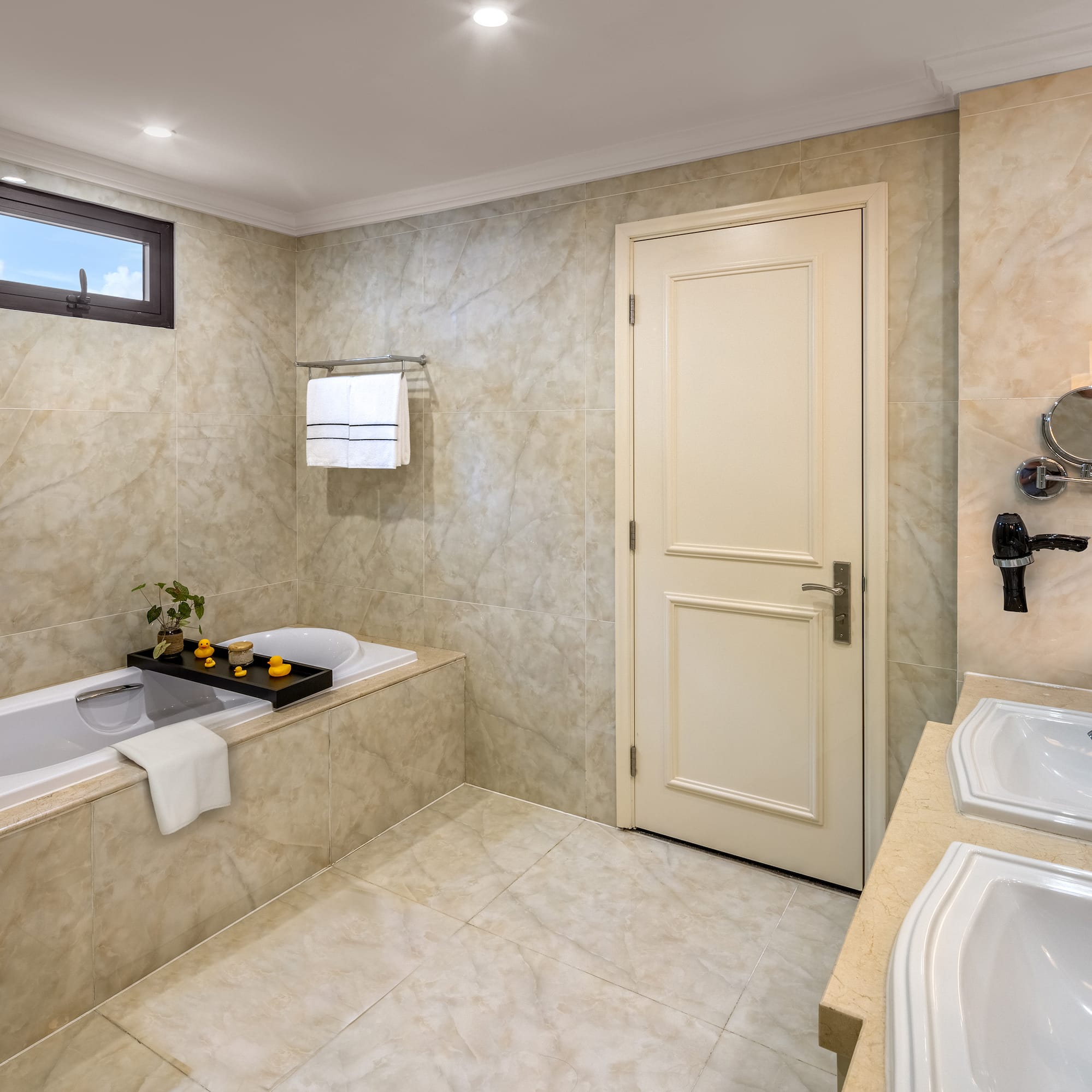 a bathroom with marble walls and a bathtub