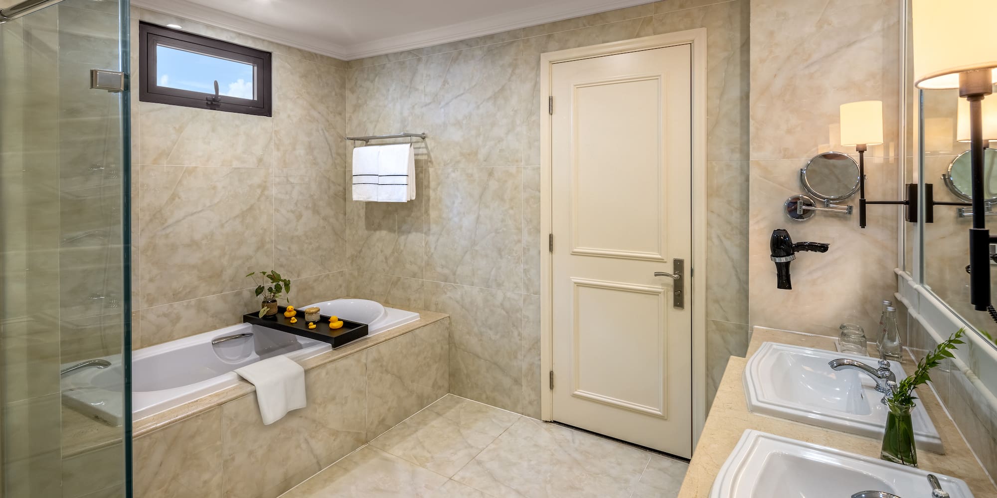 a bathroom with marble walls and a bathtub
