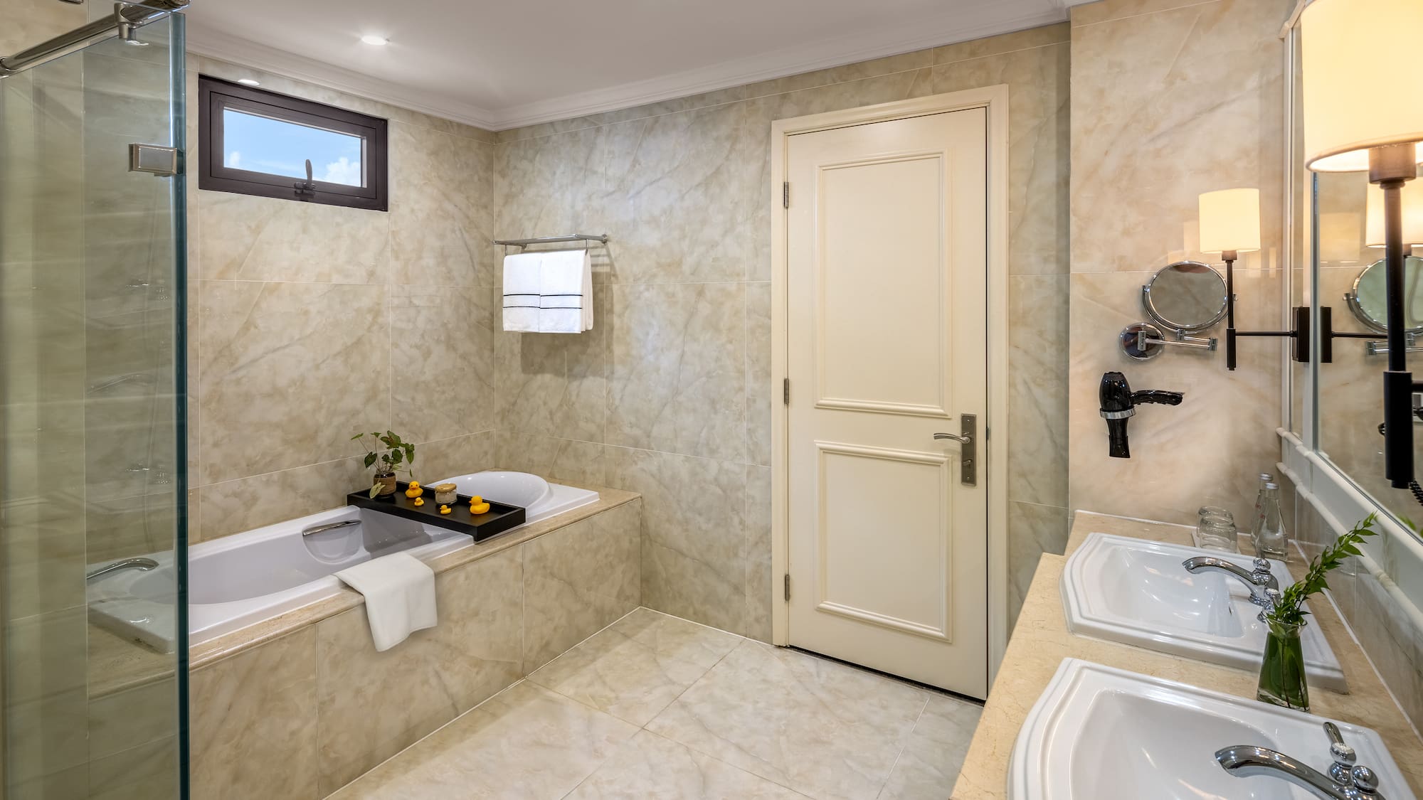 a bathroom with marble walls and a bathtub