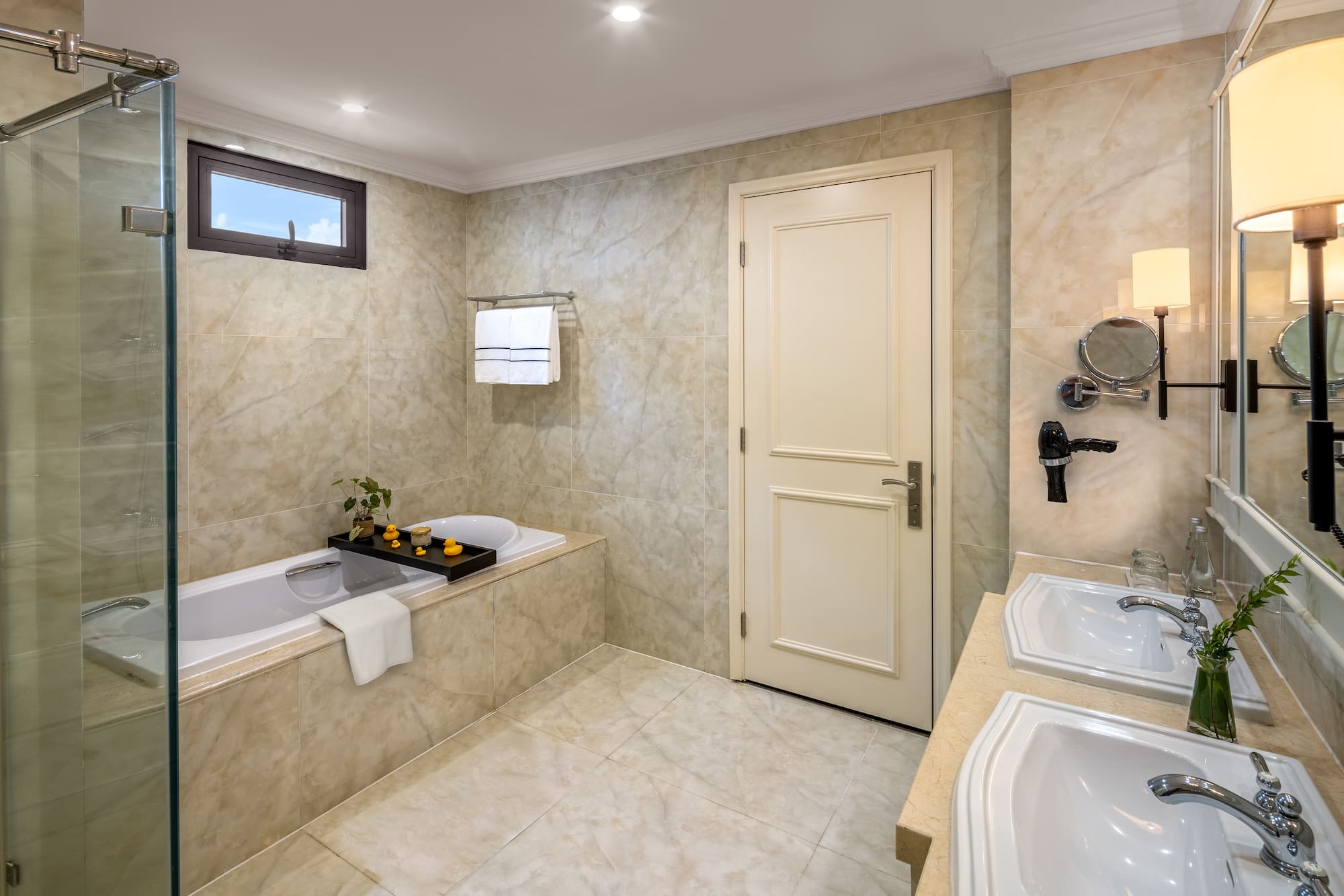 a bathroom with marble walls and a bathtub