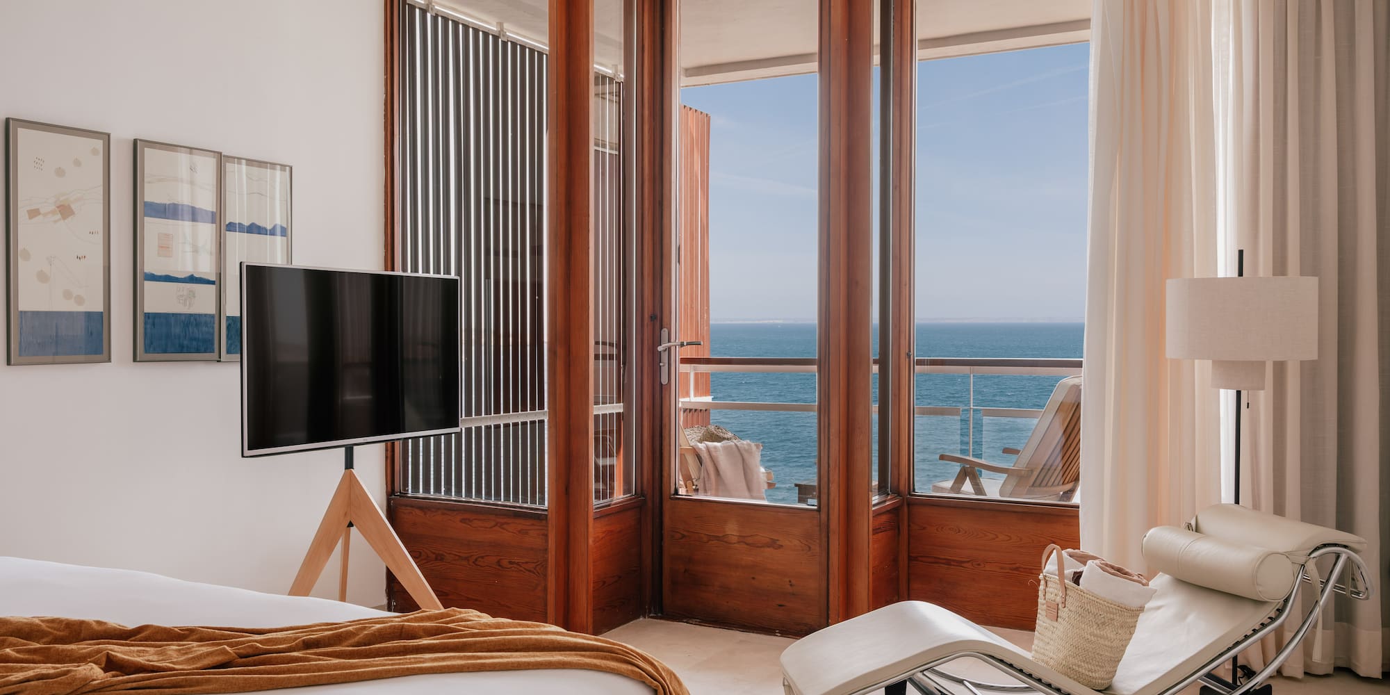 a bedroom with a television and a chair