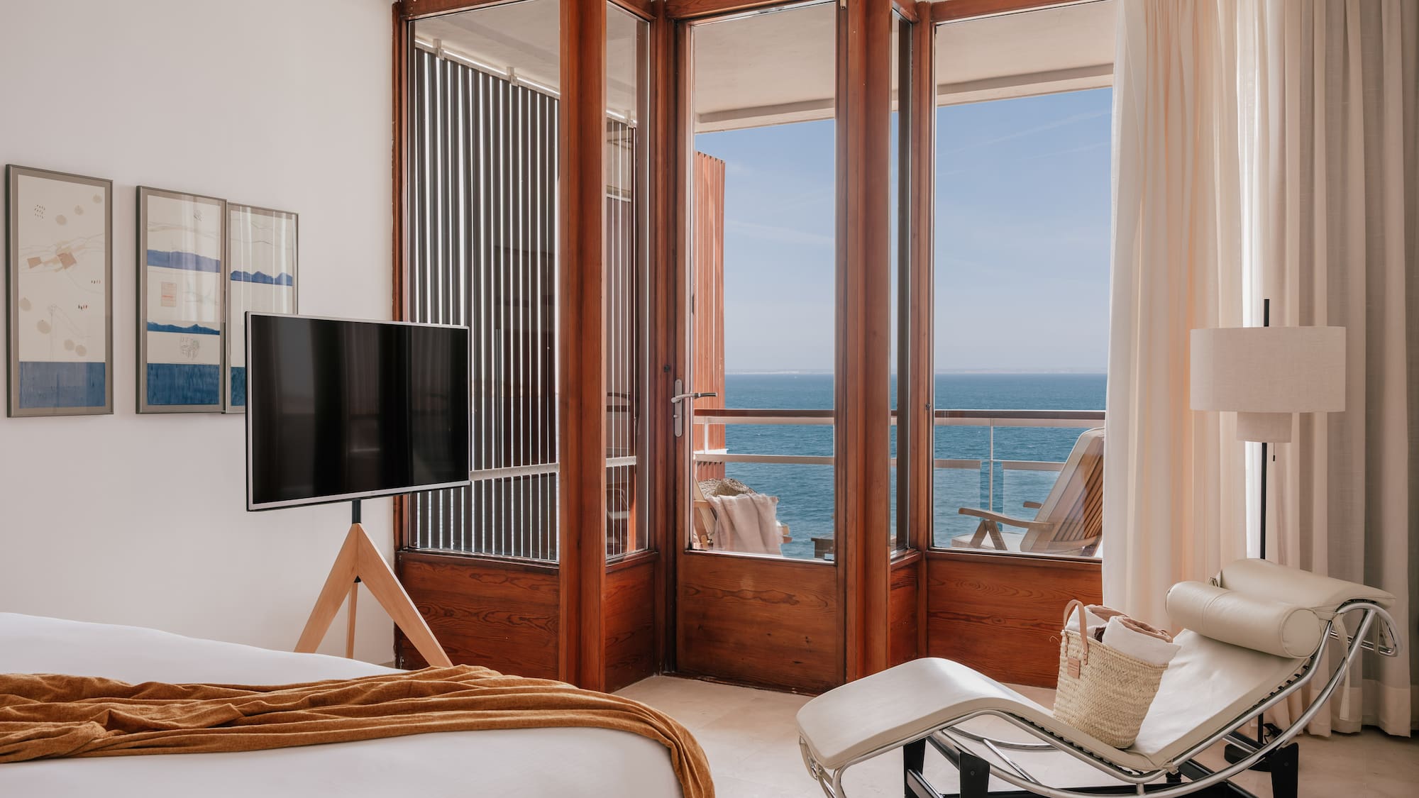 a bedroom with a television and a chair