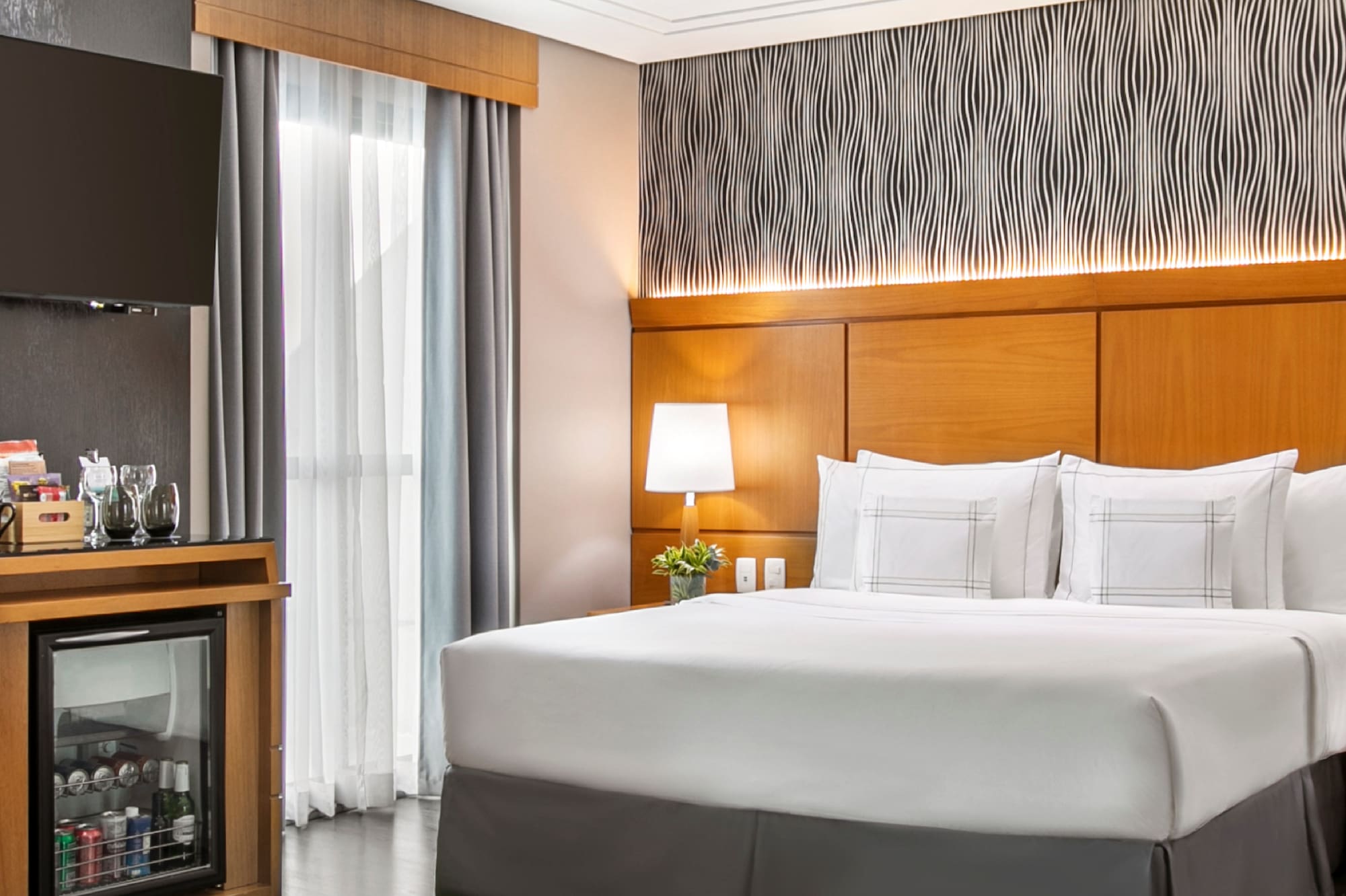 a room with a bed and a cabinet