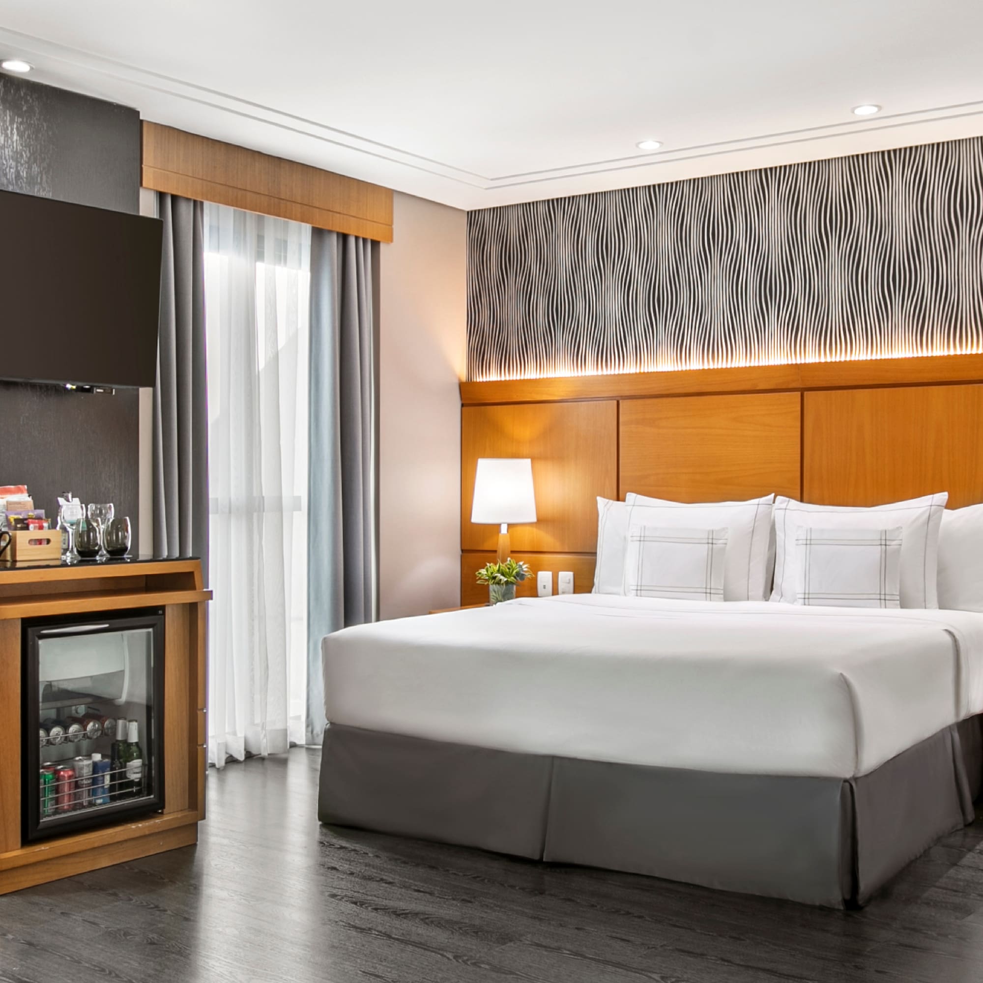 a room with a bed and a cabinet