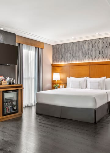 a room with a bed and a cabinet