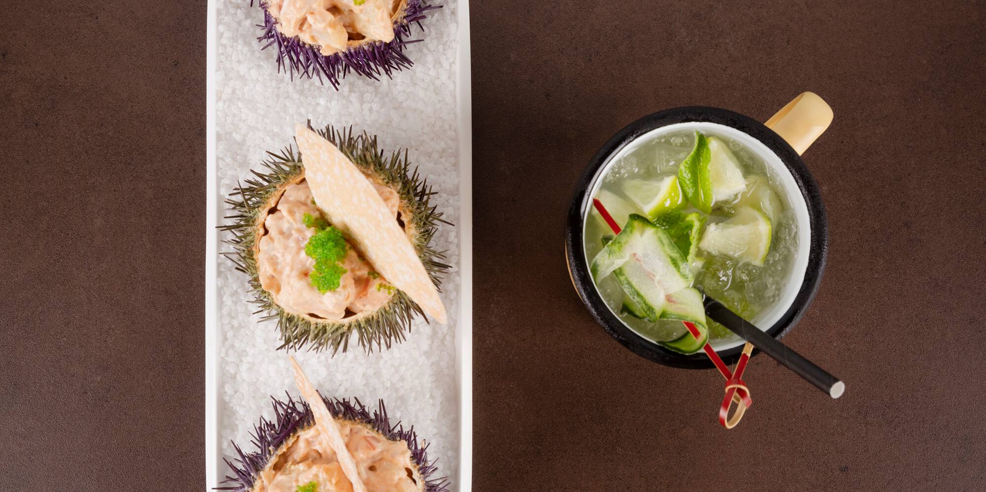 a tray of food and a cup of drink