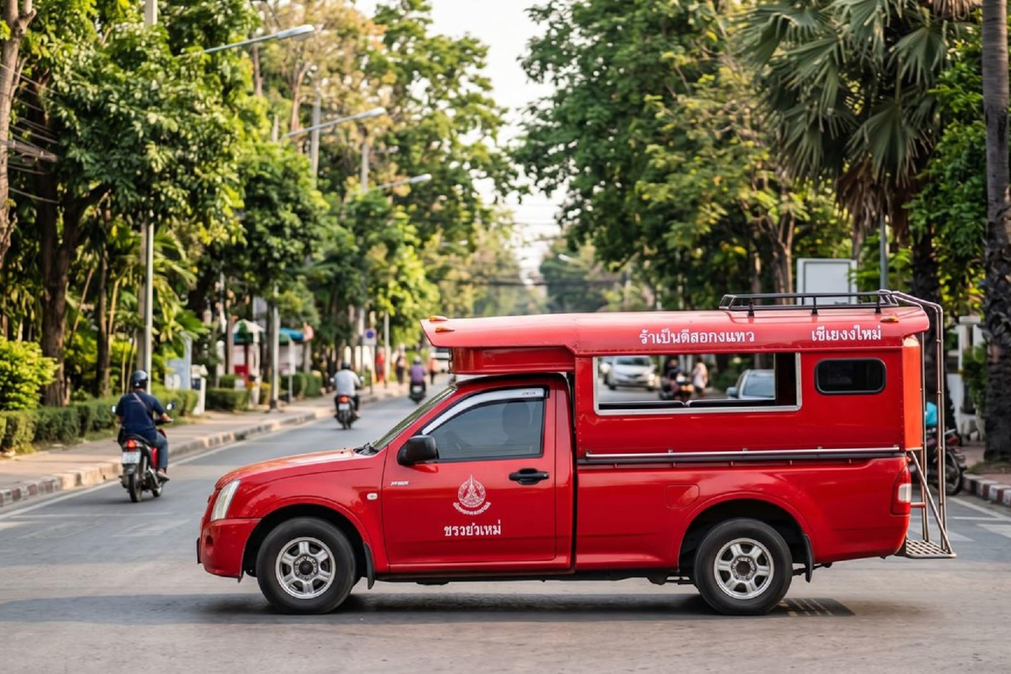 Red songthaew public transport truck in Chiang Mai, Thailand.