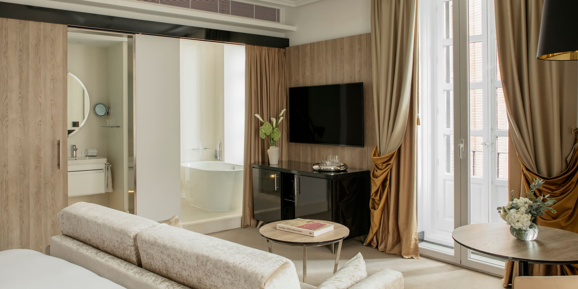 a room with a television and a tub