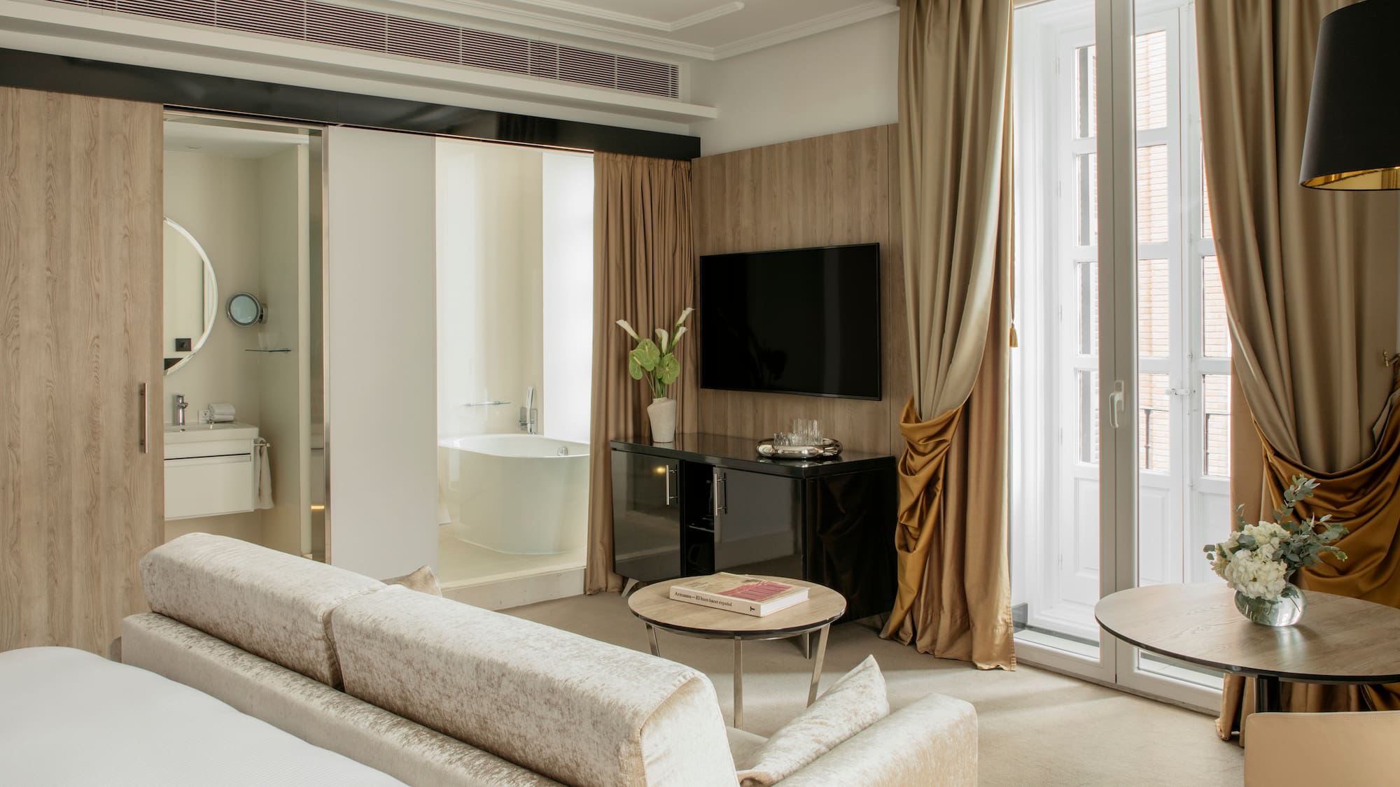 a room with a television and a tub