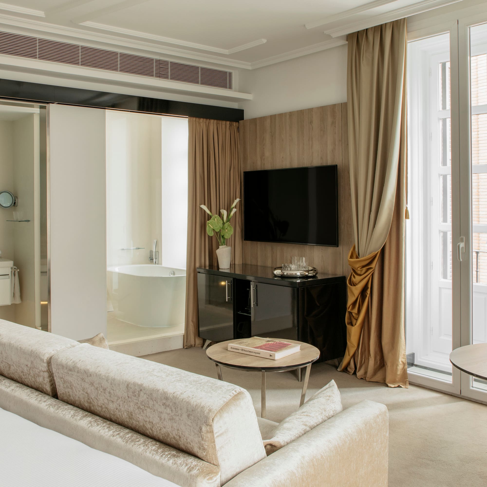 a room with a television and a tub