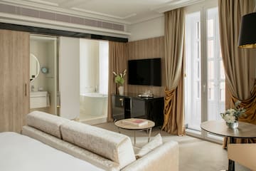 a room with a television and a tub