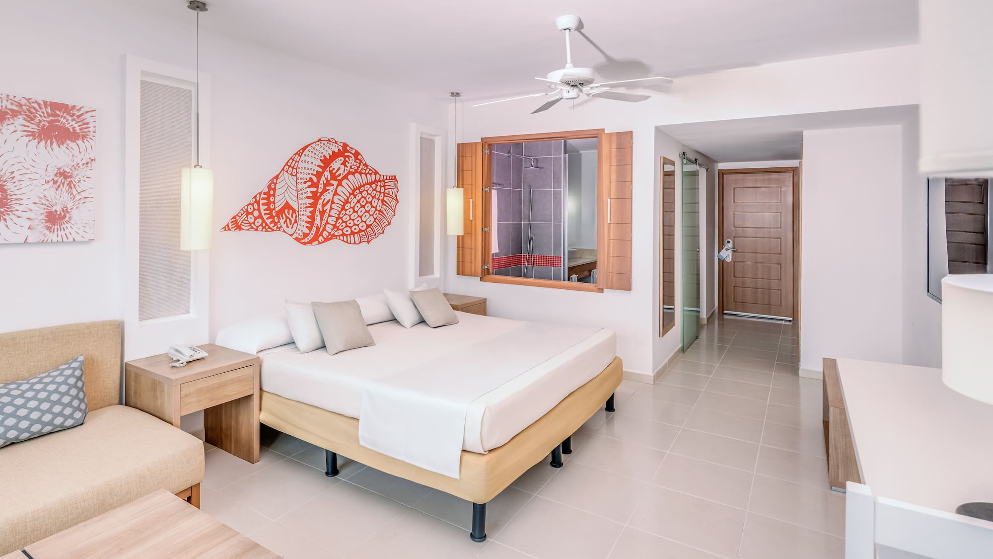 a room with a bed and a fan