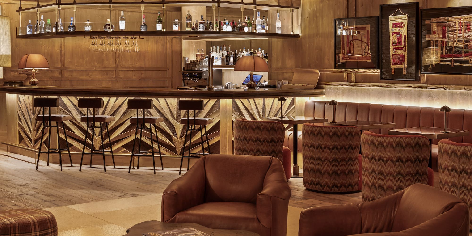 a room with a bar and chairs