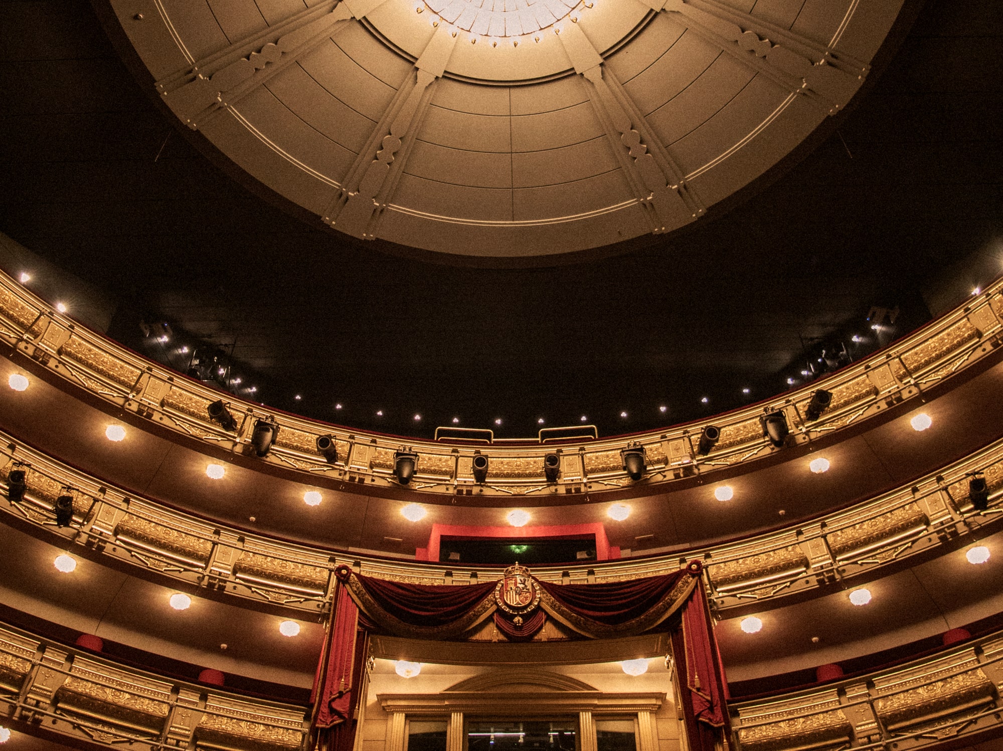 two women standing in front of a wall