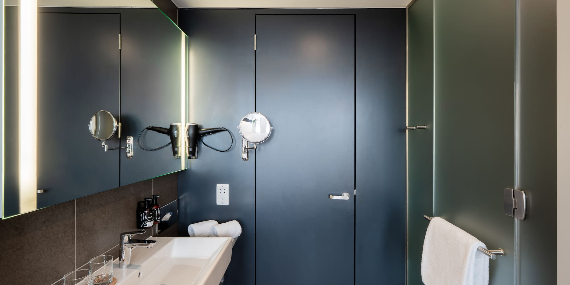 a bathroom with a mirror and sink