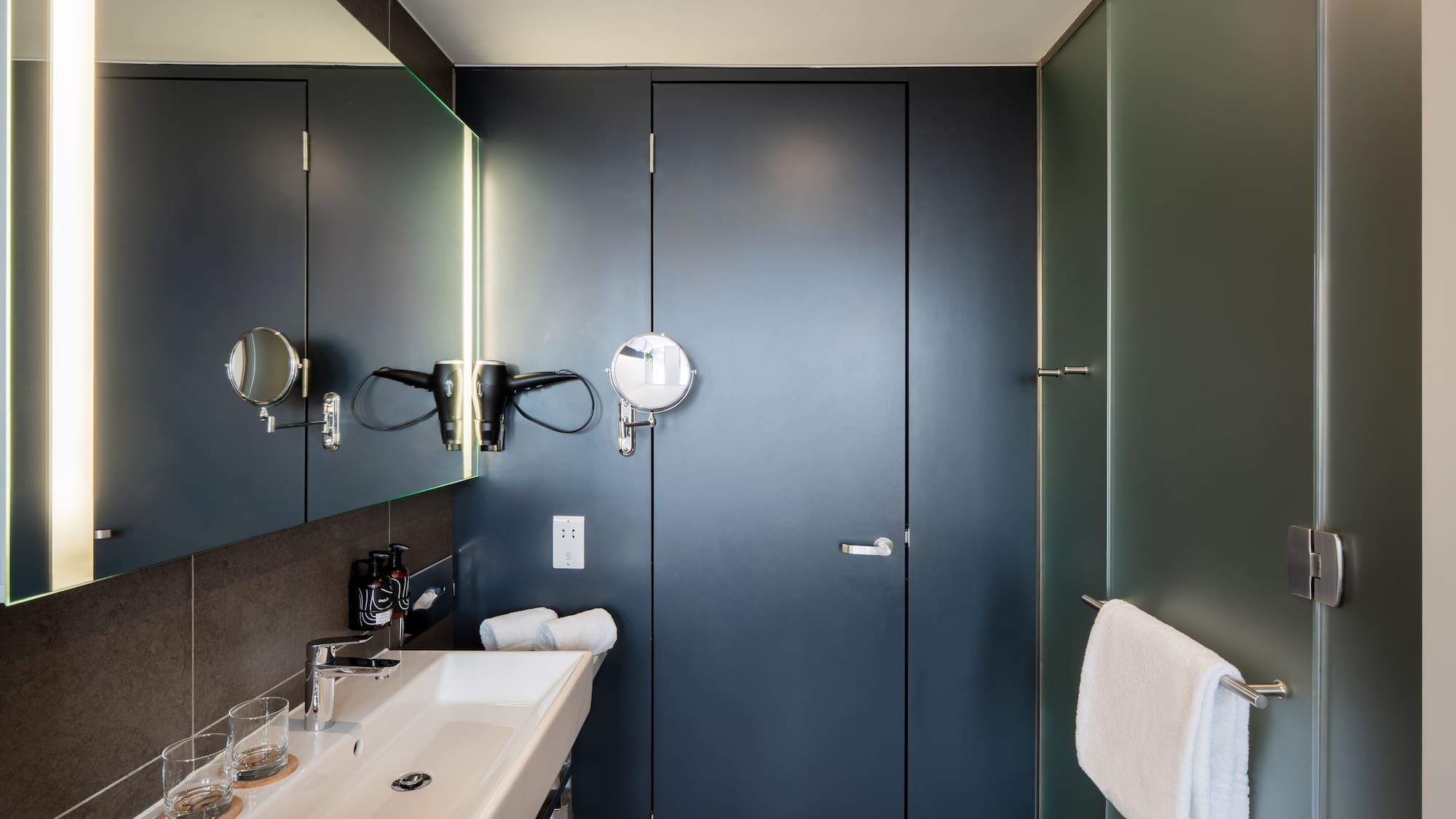 a bathroom with a mirror and sink