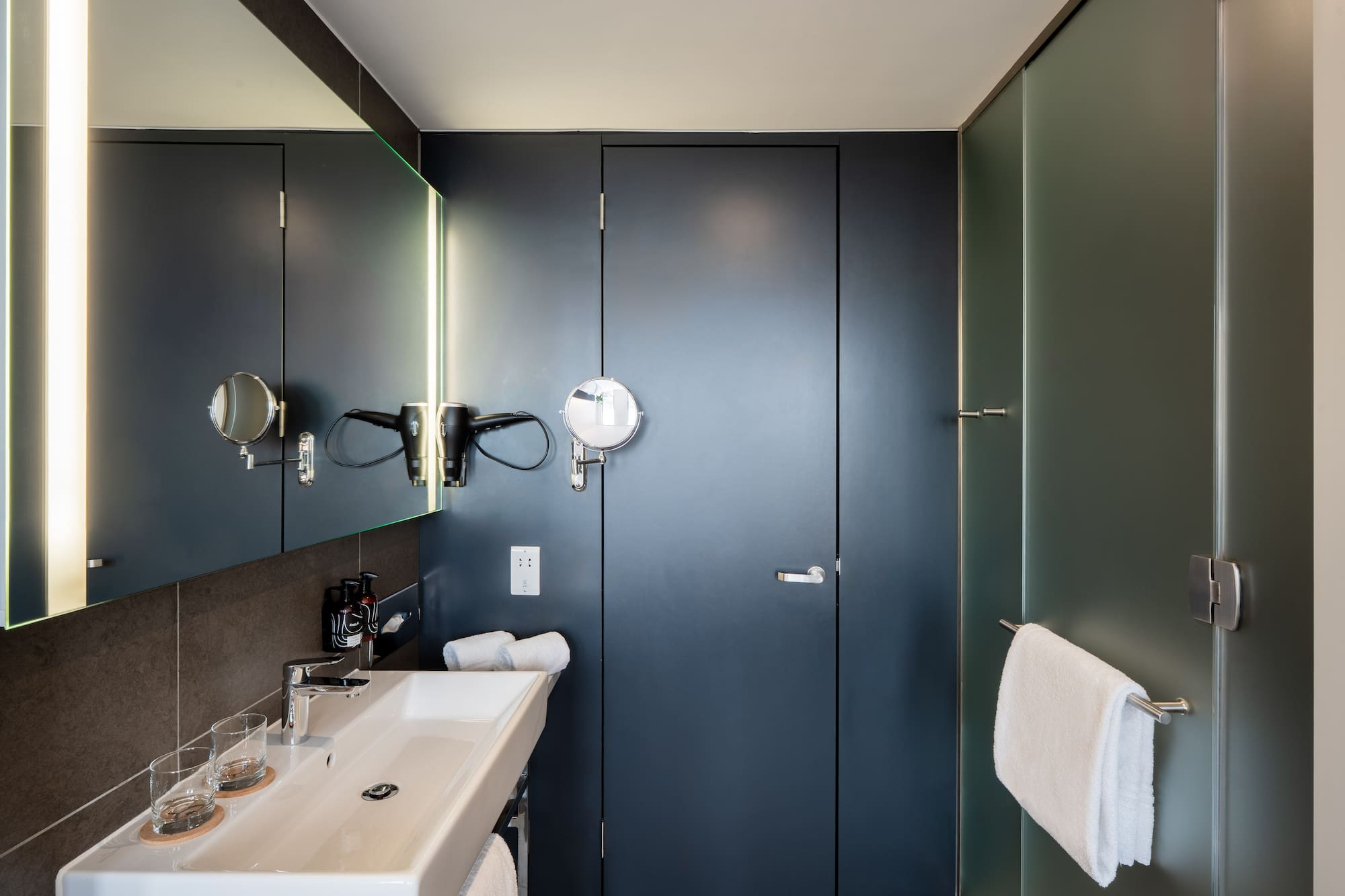 a bathroom with a mirror and sink