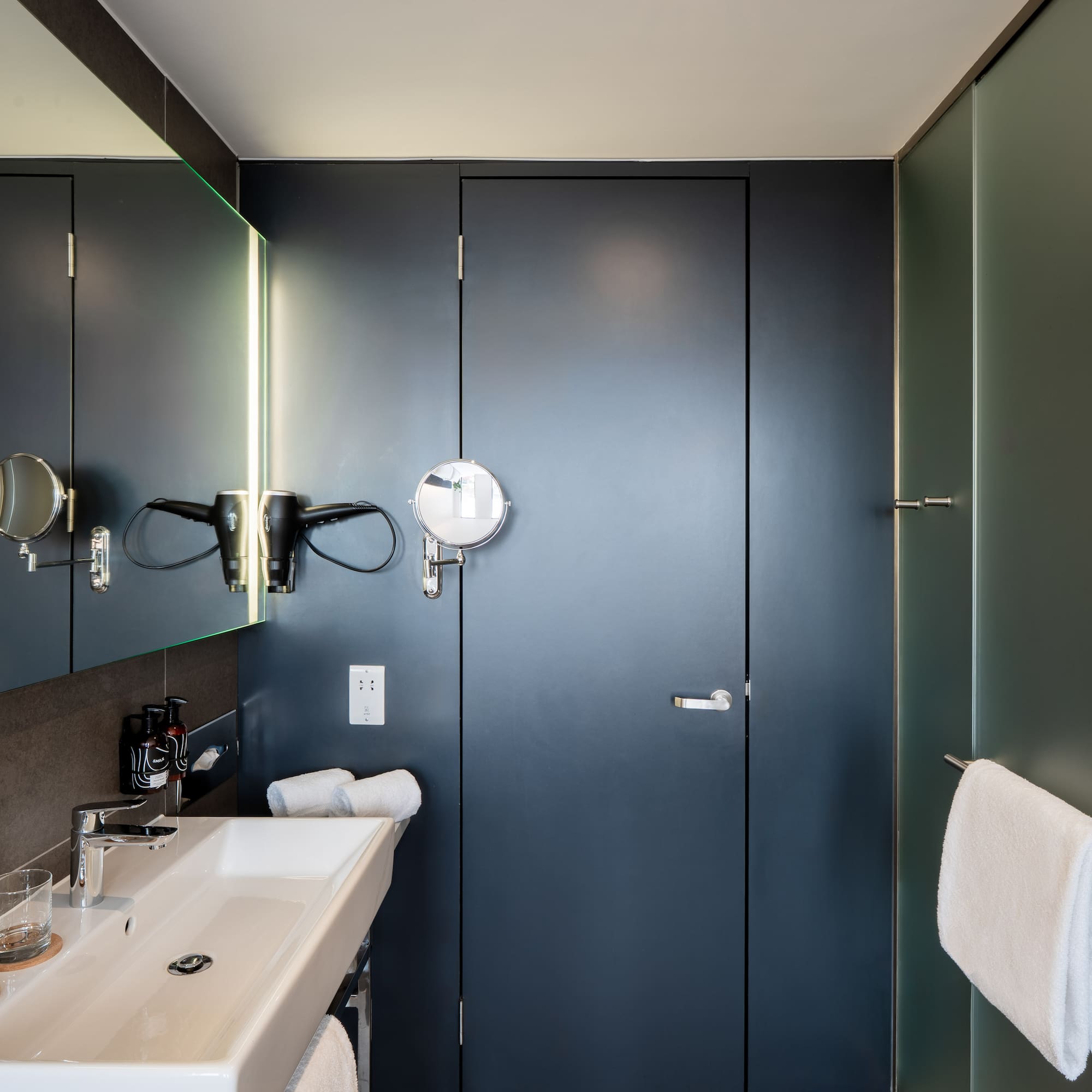 a bathroom with a mirror and sink