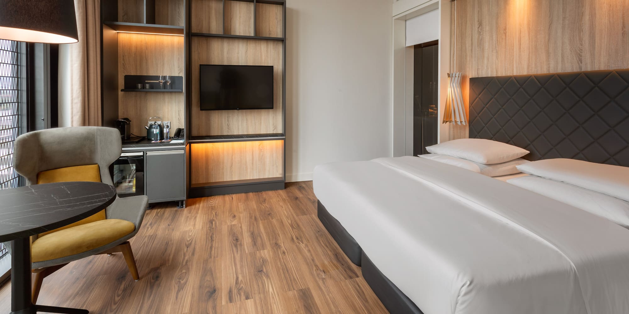 a room with a bed and a tv