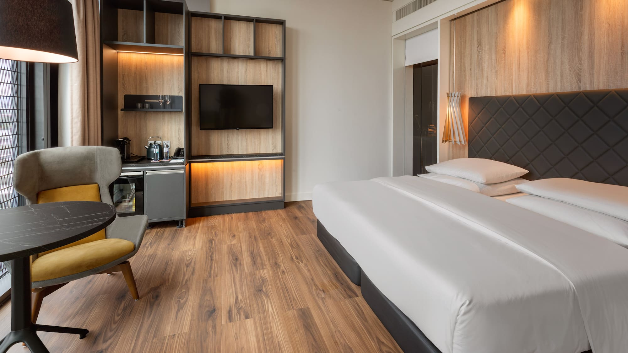 a room with a bed and a tv