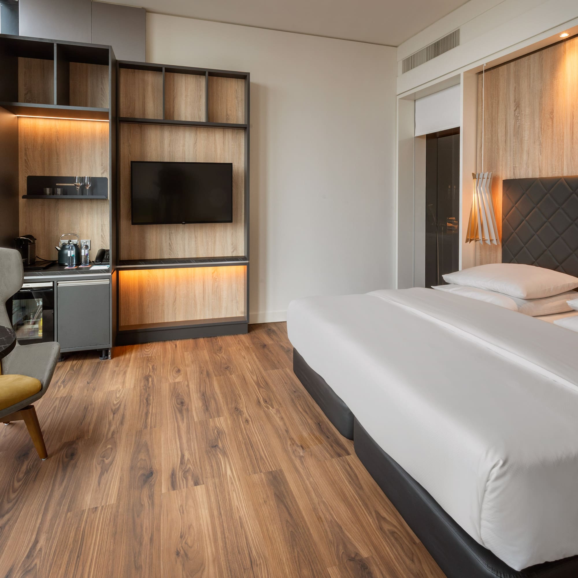 a room with a bed and a tv