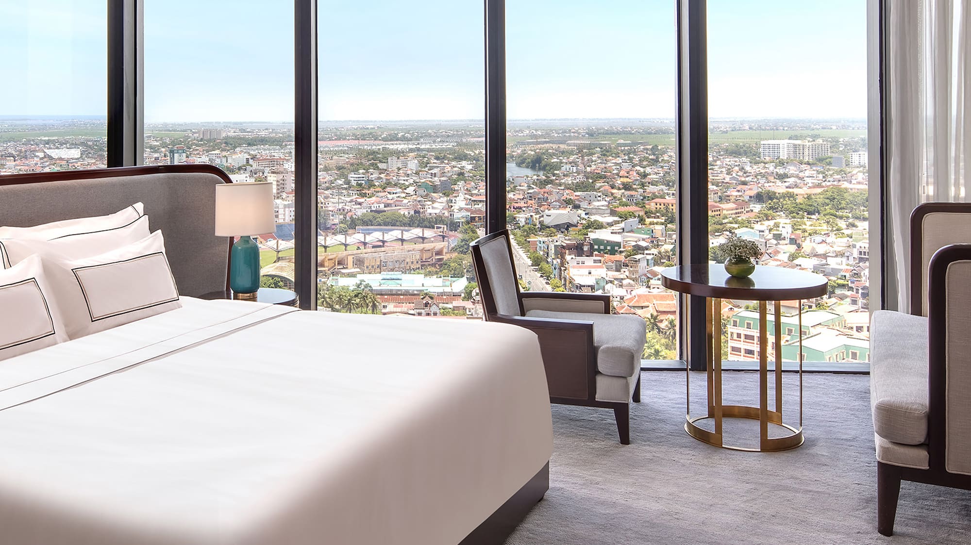 a room with a large window overlooking a city